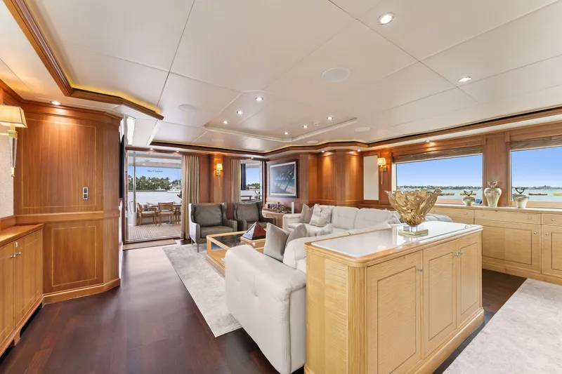 Slide: The Image of Luxurious dining area on 2006 Palmer Johnson motor yacht with elegant wood paneling and ocean view. - 33