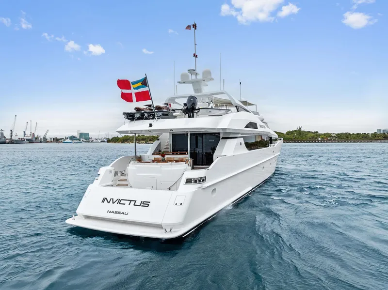 Slide: The Image of Palmer Johnson 2006 motor yacht on open water, rear view with flags. - 4