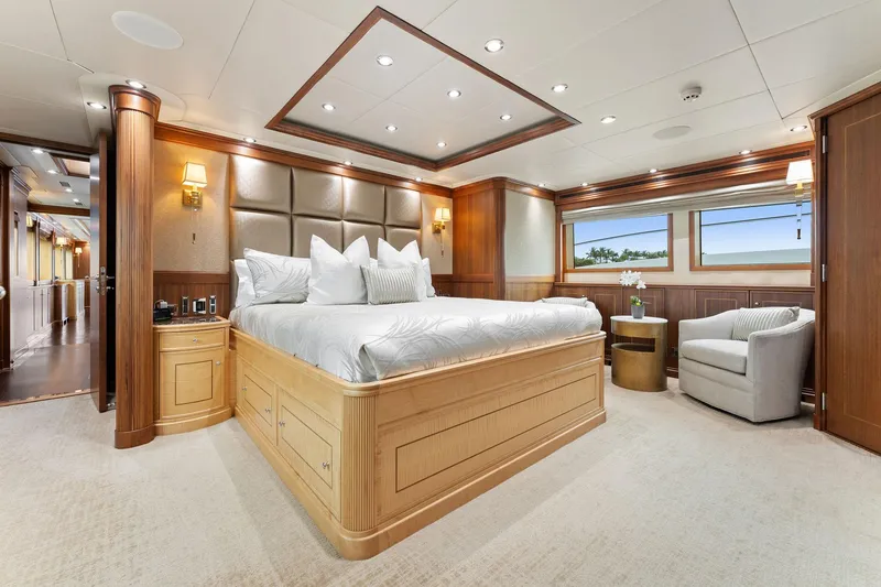 Slide: The Image of Luxurious 2006 Palmer Johnson motor yacht bedroom with elegant wood finishes and plush bedding. - 41