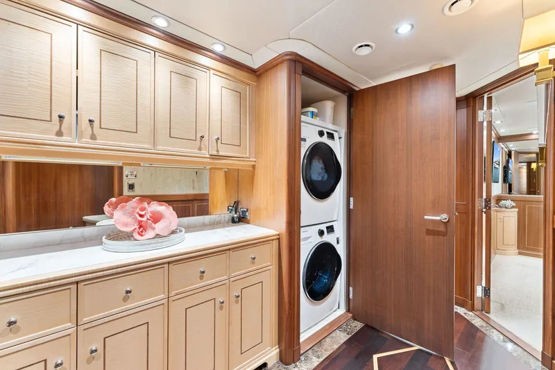 Slide: The Image of Luxurious 2006 Palmer Johnson motor yacht bedroom with elegant wood paneling and cozy bedding. - 47