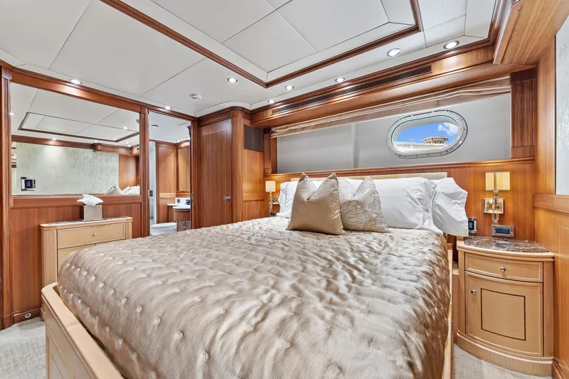 Slide: The Image of Luxurious bedroom interior of 2006 Palmer Johnson 123 Motor Yacht with elegant wood paneling. - 49