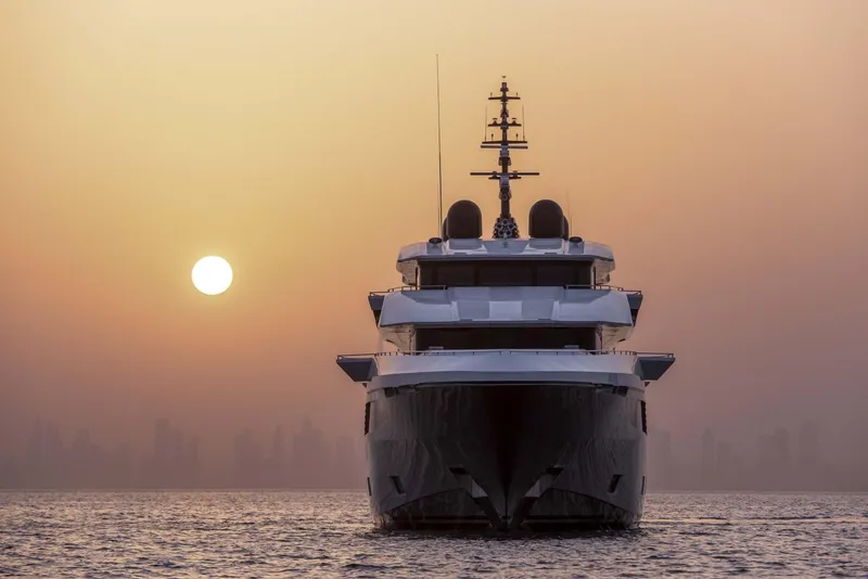Slide: The Image of Majesty 175 yacht at sunset, 2026 model, on calm sea with city skyline. - 11