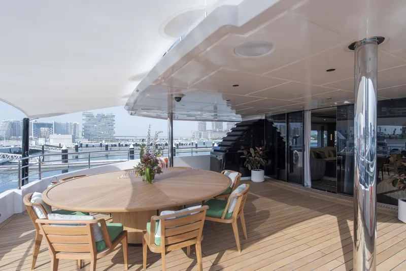 Slide: The Image of Luxurious 2026 Majesty 175 yacht deck with elegant outdoor dining area. - 13