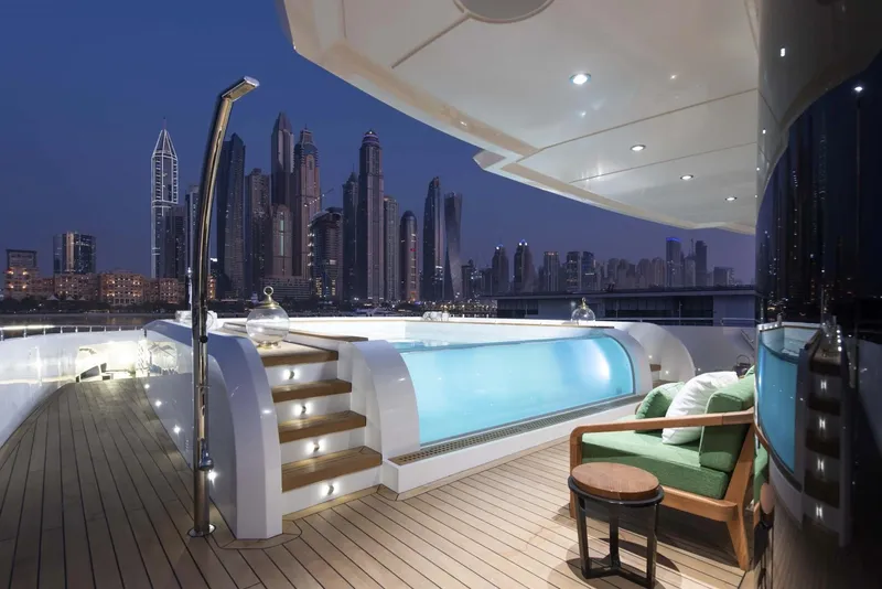 Slide: The Image of Luxurious 2026 Majesty 175 yacht with pool, city skyline view at dusk. - 15