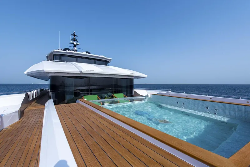 Slide: The Image of Luxurious 2026 Majesty 175 yacht with pool, cruising on open sea. - 17