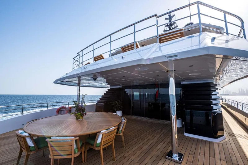 Slide: The Image of Luxurious 2026 Majesty 175 yacht deck with ocean view and elegant dining area. - 18