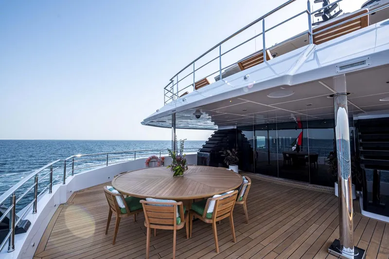 Slide: The Image of Luxurious 2026 Majesty 175 yacht deck with ocean view and elegant dining area. - 19
