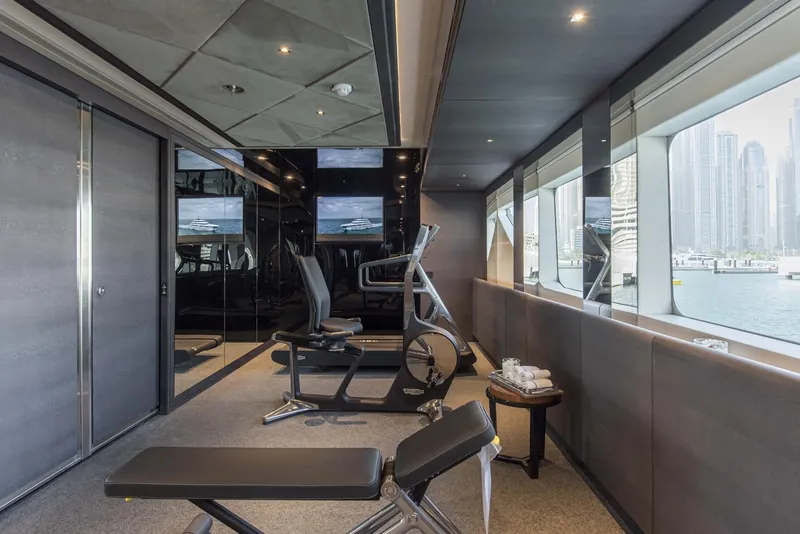 Slide: The Image of Luxurious gym on 2026 Majesty 175 yacht with cityscape view. - 27