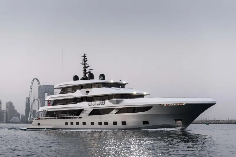 Slide: The Image of Luxurious 2026 Majesty 175 yacht cruising near city skyline and Ferris wheel. - 3