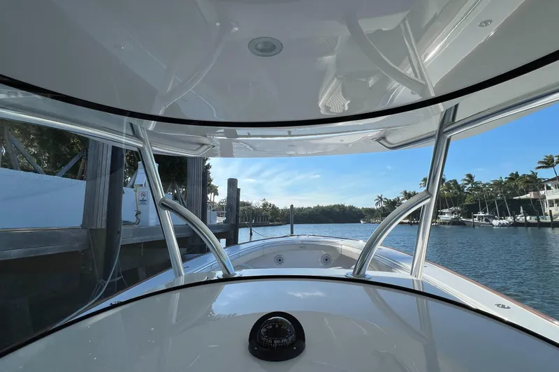 Slide: The Image of 2021 Valhalla Boatworks V-41 on a serene waterfront dock. - 13