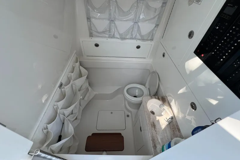 Slide: The Image of 2021 Valhalla V-41 boat interior bathroom with storage and sink. - 22