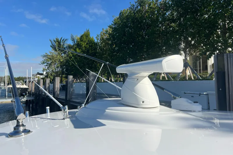 Slide: The Image of 2021 Valhalla Boatworks V-41 radar system on deck, docked near trees. - 24