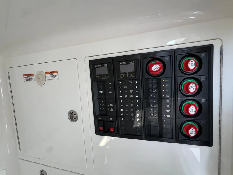 Slide: The Image of Control panel of 2021 Valhalla Boatworks V-41, featuring switches and gauges. - 25