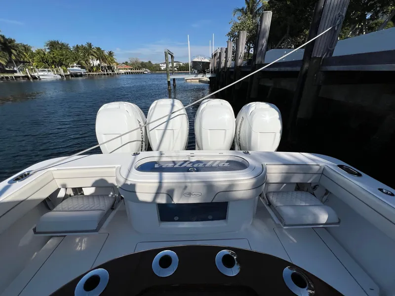 Slide: The Image of 2021 Valhalla Boatworks V-41 with four outboard engines docked by the water. - 4