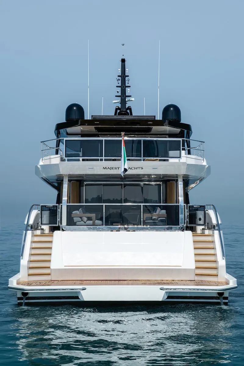 Slide: The Image of Majesty 111 yacht, 2026 model, on calm sea, rear view. - 10
