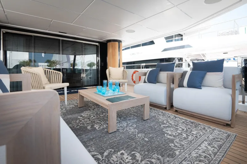 Slide: The Image of Luxurious Majesty 111 yacht interior, 2026 model, featuring elegant seating and decor. - 11