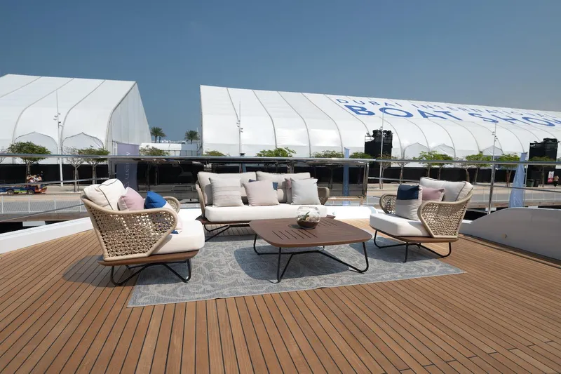 Slide: The Image of Luxurious deck seating on 2026 Majesty 111 yacht at boat show. - 12