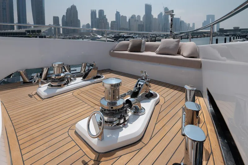 Slide: The Image of Luxurious 2026 Majesty 111 yacht deck with city skyline view. - 13