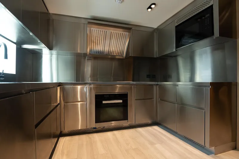 Slide: The Image of Modern stainless steel kitchen on Majesty 111 yacht, 2026 model. - 24