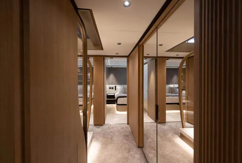 Slide: The Image of Luxurious interior of 2026 Majesty 111 yacht with modern wood paneling and elegant design. - 27