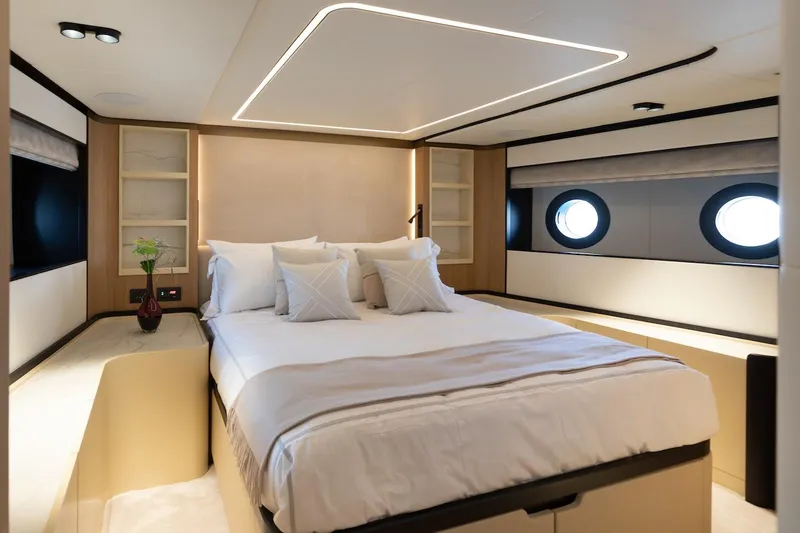 Slide: The Image of Luxurious bedroom interior on 2026 Majesty 111 yacht, featuring modern design and elegant furnishings. - 32