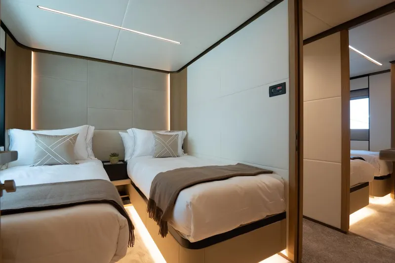 Slide: The Image of Luxurious twin bedroom on 2026 Majesty 111 yacht, featuring modern design and ambient lighting. - 33