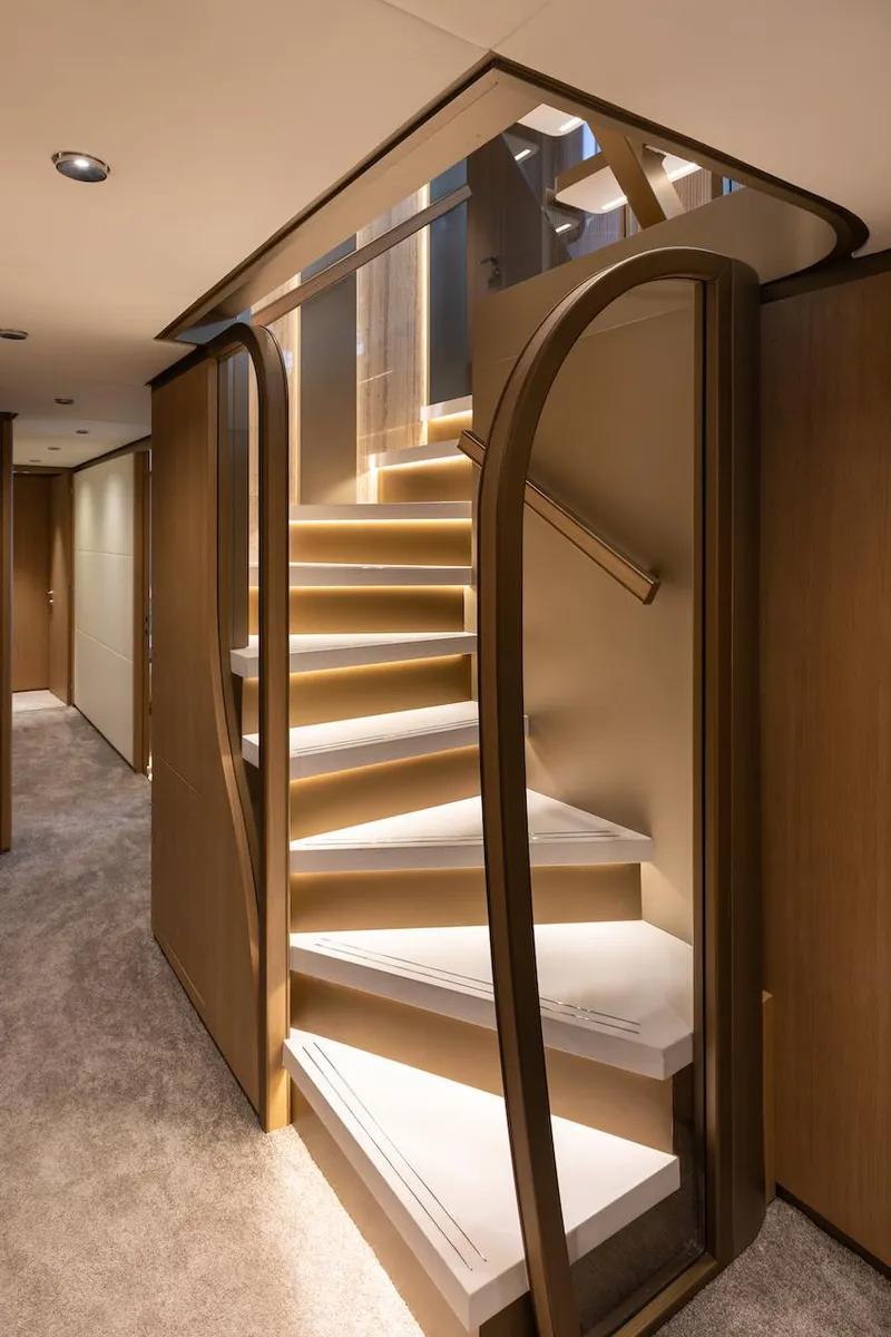Slide: The Image of Elegant staircase in 2026 Majesty 111 yacht interior, featuring modern design and ambient lighting. - 40