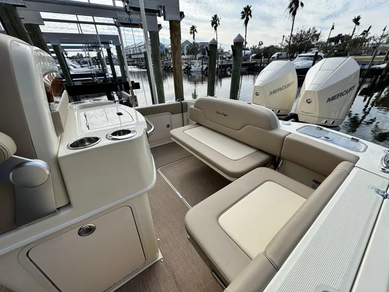 Slide: The Image of 2025 Chris-Craft Catalina 28 boat interior with seating and twin Mercury engines. - 10