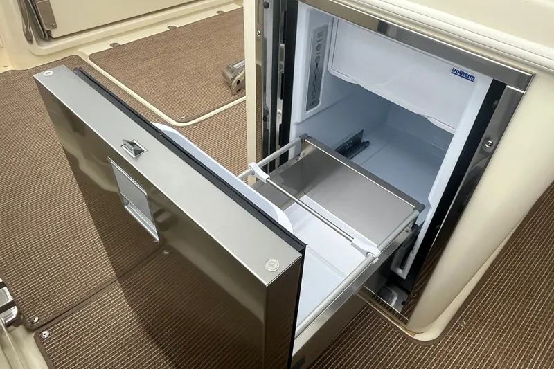 Slide: The Image of Stainless steel refrigerator on 2025 Chris-Craft Catalina 28 boat, open drawer view. - 13
