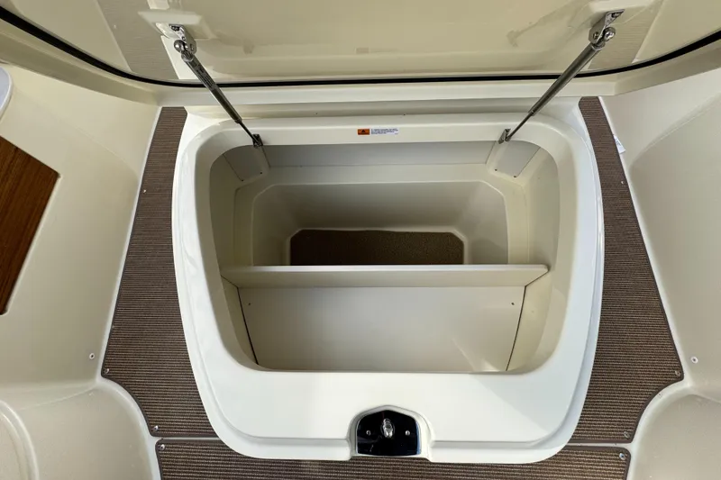 Slide: The Image of Open storage compartment on 2025 Chris-Craft Catalina 28 boat. - 27