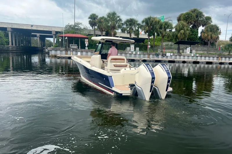 Slide: The Image of 2025 Chris-Craft Catalina 28 boat with dual engines on a calm waterway. - 3