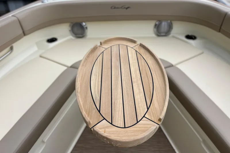 Slide: The Image of 2025 Chris-Craft Catalina 28 boat interior with wooden table and seating. - 30