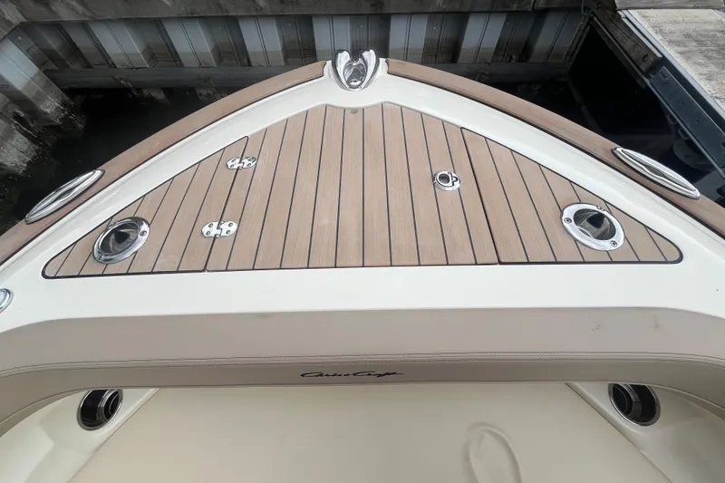 Slide: The Image of 2025 Chris-Craft Catalina 28 boat deck with wood finish and stainless steel fittings. - 34