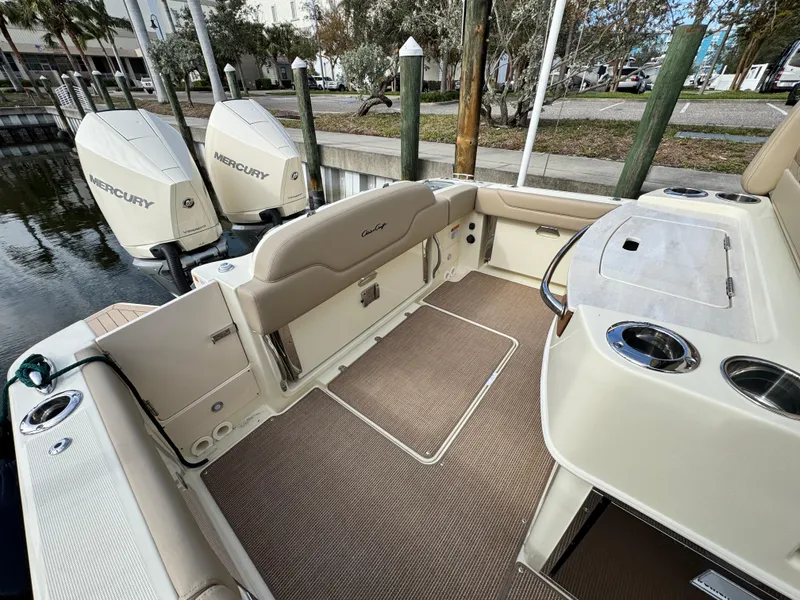 Slide: The Image of 2025 Chris-Craft Catalina 28 boat interior with Mercury engines, docked at marina. - 8