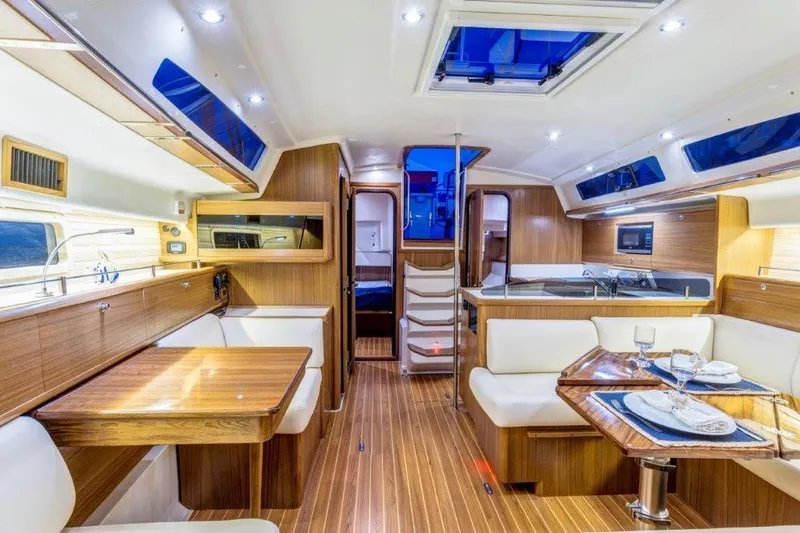 Slide: The Image of Luxurious interior of 2025 Catalina 426 yacht with modern dining and kitchen area. - 3