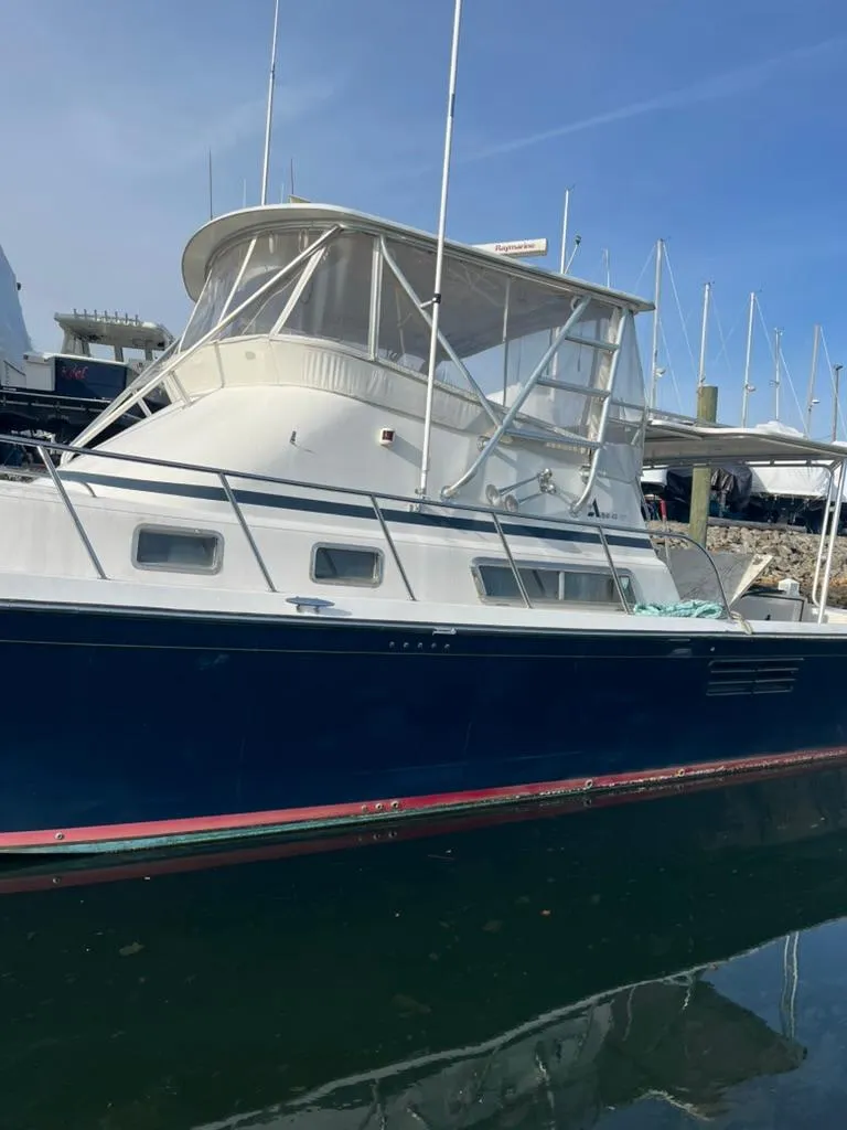 Slide: The Image of 2005 Albin 45 Command Bridge yacht docked in marina. - 11