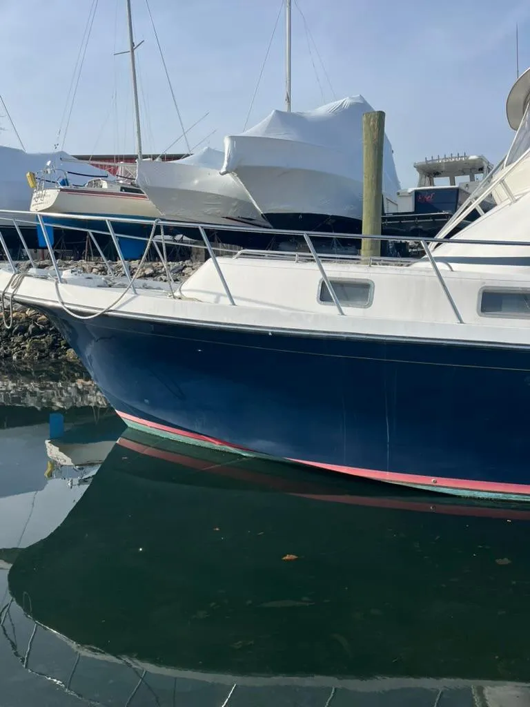 Slide: The Image of 2005 Albin 45 Command Bridge yacht docked in marina. - 12