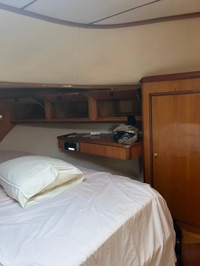 Slide: The Image of Interior cabin of 2005 Albin 45 Command Bridge with bed and wooden storage. - 20