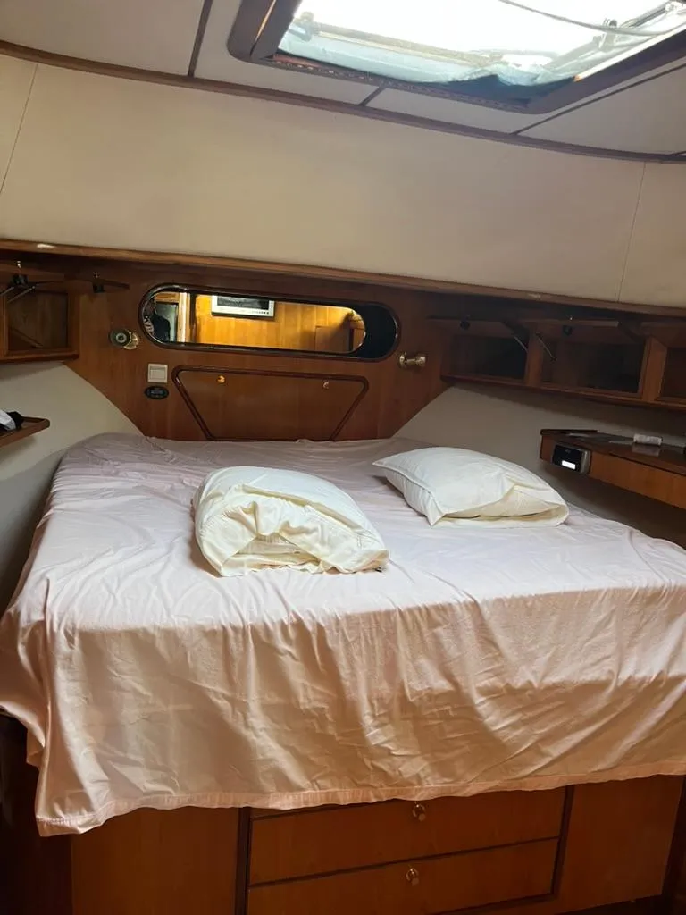 Slide: The Image of Cozy cabin interior of 2005 Albin 45 Command Bridge with bed and pillows. - 3