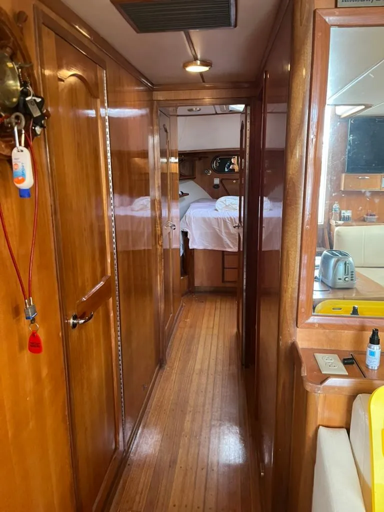 Slide: The Image of 2005 Albin 45 Command Bridge interior with wooden finish and cozy cabin. - 5