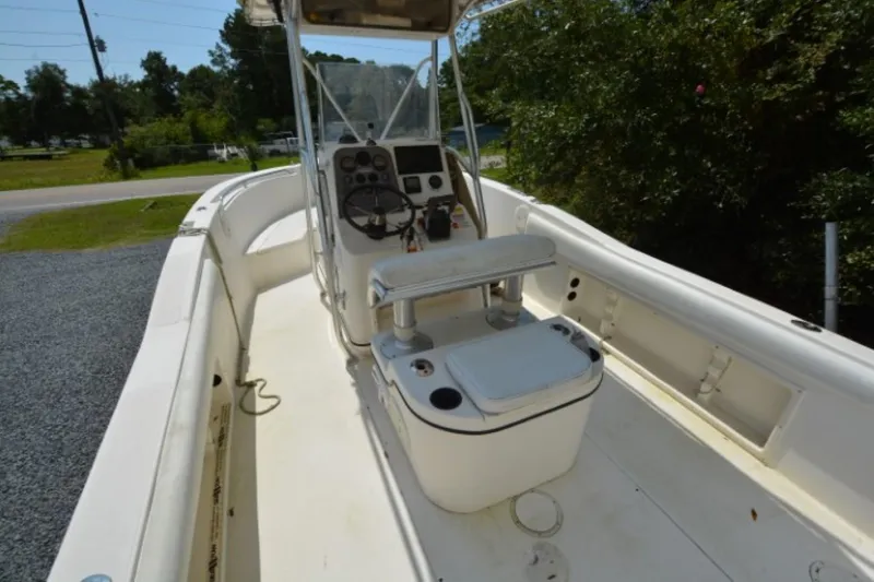 Slide: The Image of 1999 Hydra-Sports 2450 CCH boat interior with console and seating. - 15