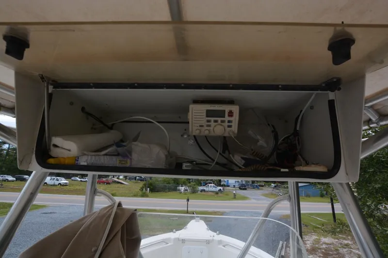 Slide: The Image of 1999 Hydra-Sports 2450 CCH boat console storage with equipment and wiring. - 21