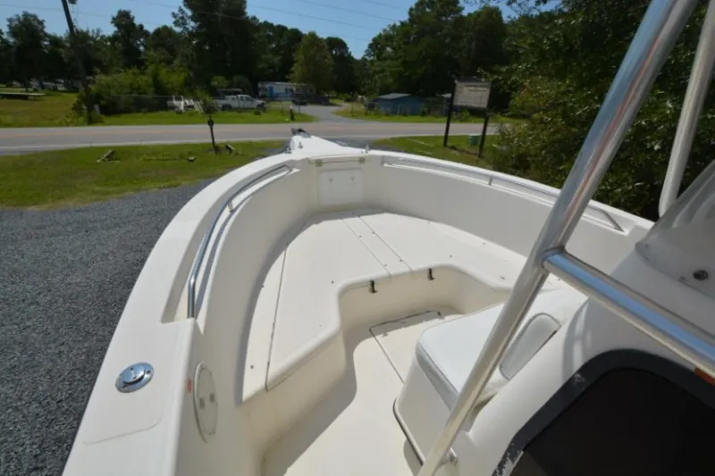 Slide: The Image of 1999 Hydra-Sports 2450 CCH boat, spacious deck view, parked outdoors. - 9