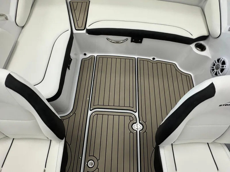Slide: The Image of 2025 Stingray 191 DC boat interior with sleek seating and stylish flooring. - 14
