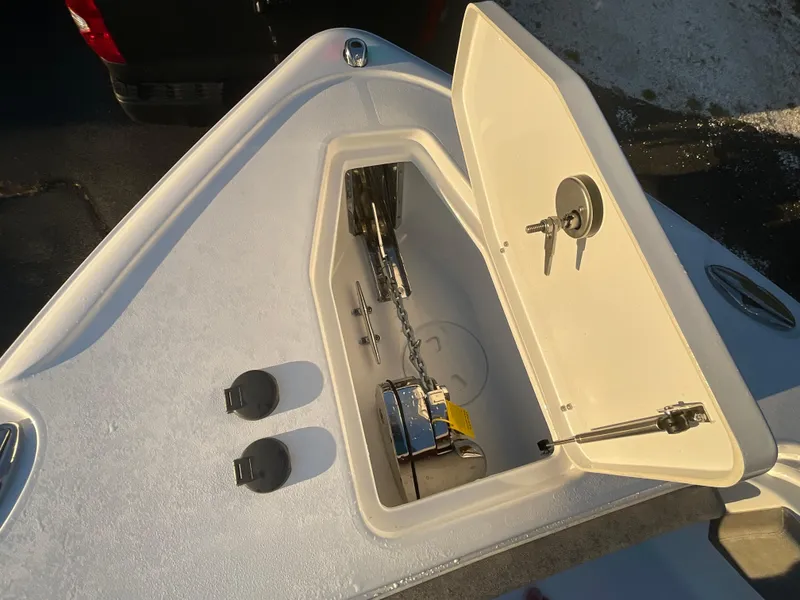 Slide: The Image of Anchor storage compartment on 2024 Sea Hunt Ultra 265 SE boat. - 14