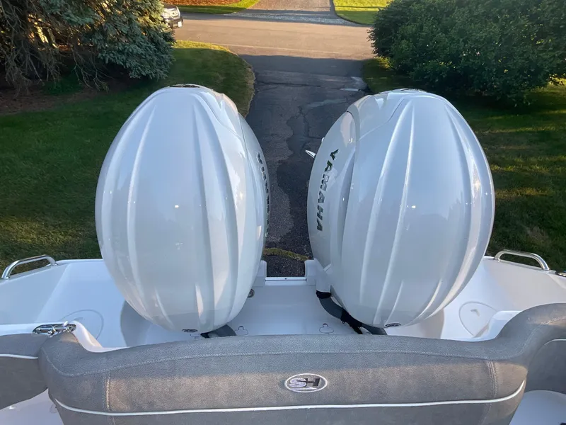 Slide: The Image of 2024 Sea Hunt Ultra 265 SE with twin Yamaha outboard engines. - 16