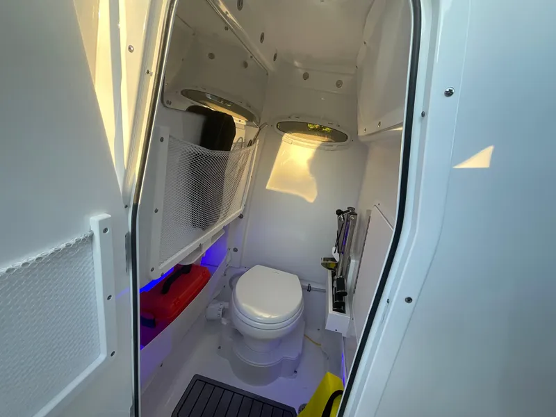 Slide: The Image of 2024 Sea Hunt Ultra 265 SE boat interior with modern bathroom amenities. - 21