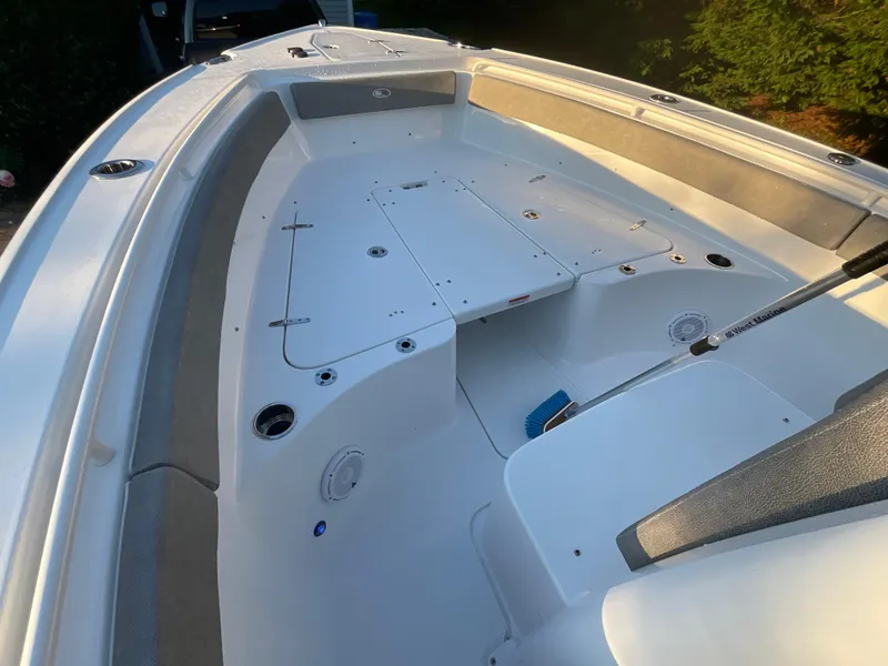 Slide: The Image of 2024 Sea Hunt Ultra 265 SE boat interior, featuring spacious seating and storage. - 9