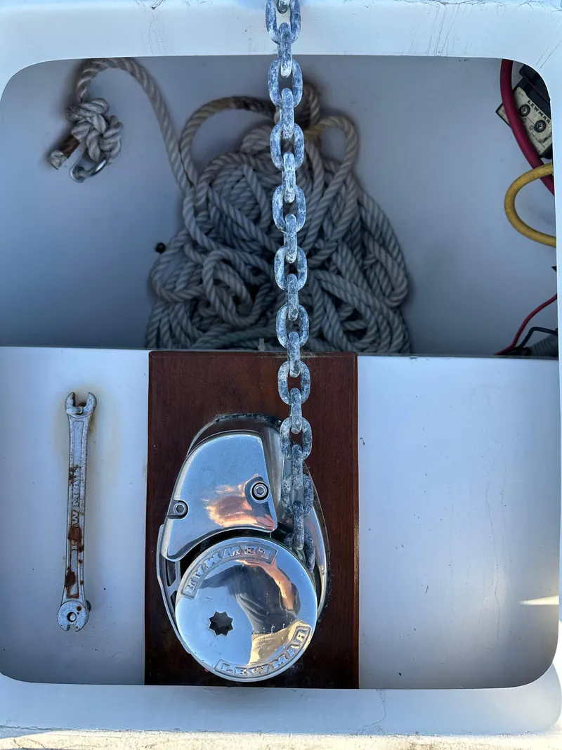 Slide: The Image of Anchor chain and winch on a 2001 Mainship Pilot 30 boat deck. - 12