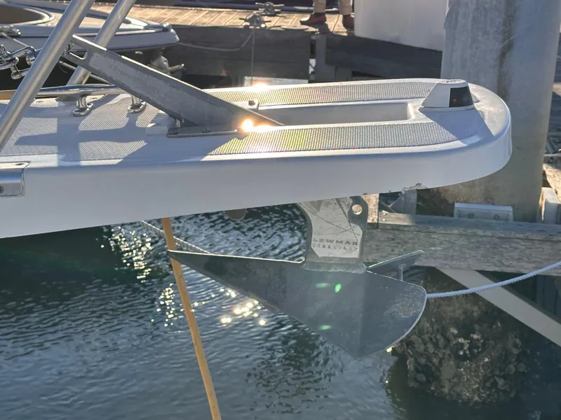 Slide: The Image of Bow of 2001 Mainship Pilot 30 with anchor, docked in sunlight. - 15